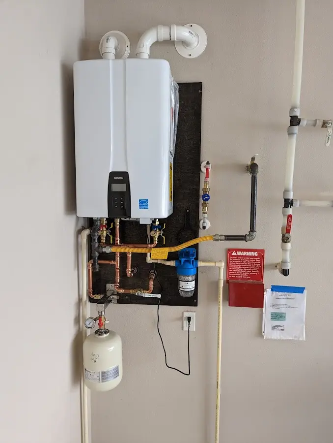 Professional plumber installing copper piping in a Cockrell Hill home